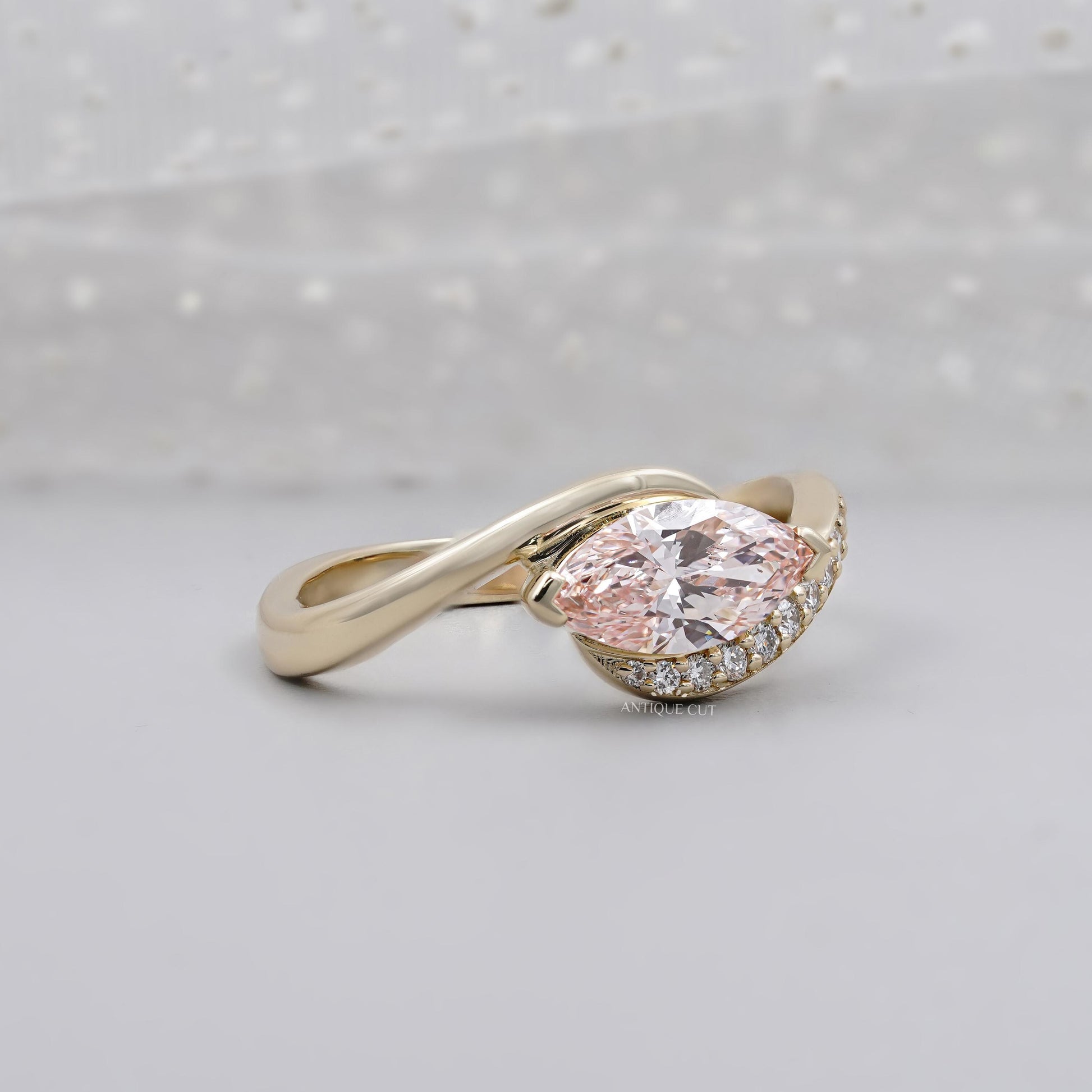 Marquise pink diamond engagement ring with bypass design