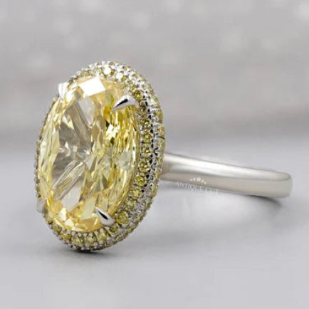Oval cut yellow diamond double halo engagement ring