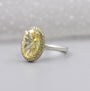 Oval cut fancy yellow diamond double halo engagement ring