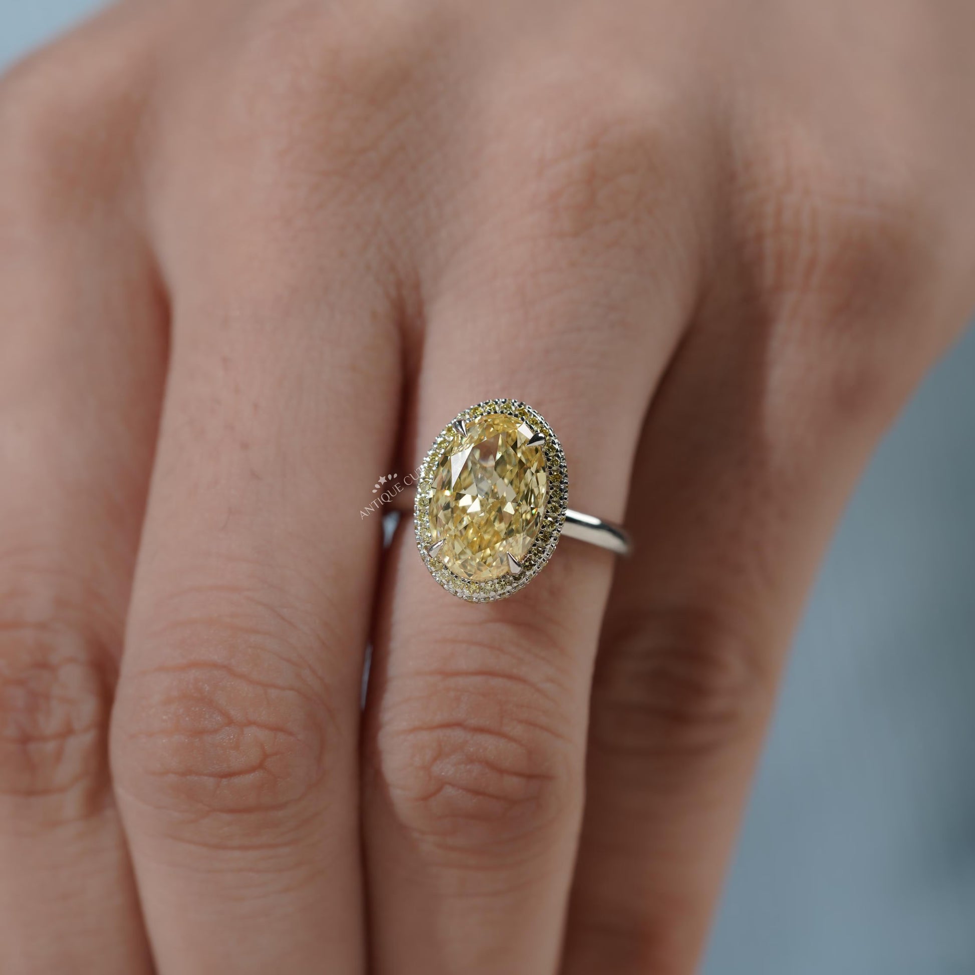 White gold double halo engagement ring with yellow diamond