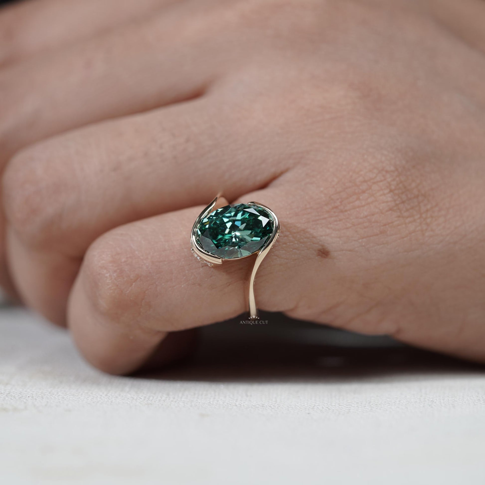 Elegant oval green diamond engagement ring