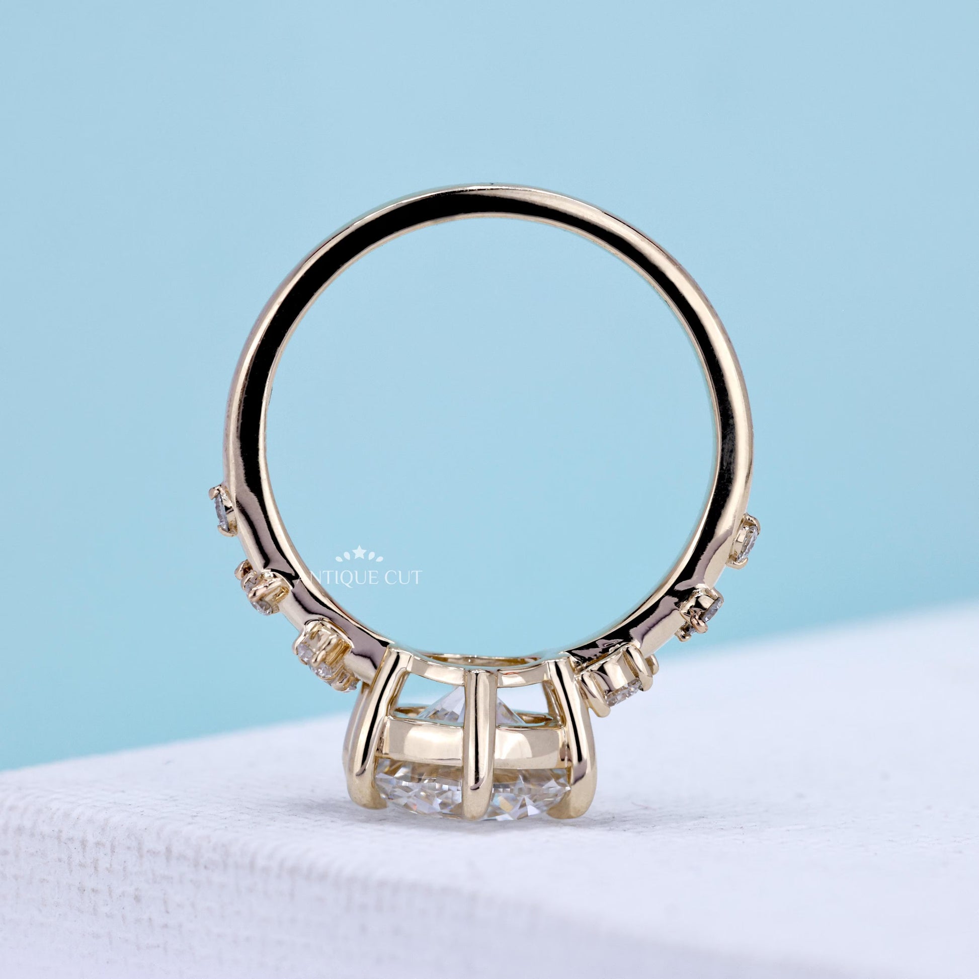 Yellow gold round diamond ring with pavé band