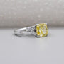 Cushion cut yellow diamond engagement ring with marquise side stones
