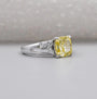 Cushion cut center diamond engagement ring with side diamonds