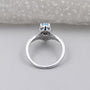 Fancy blue pear cut diamond halo engagement ring with wedding band