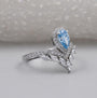 Fancy blue pear diamond engagement ring with halo