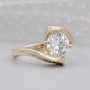 Round diamond bypass engagement ring with hidden heart halo