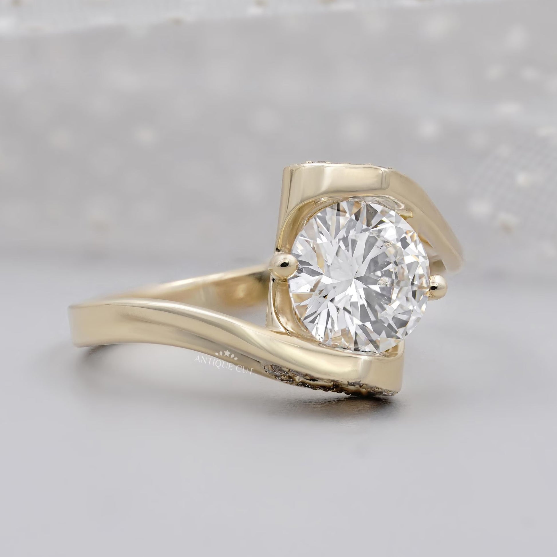 Round diamond bypass engagement ring with hidden heart halo