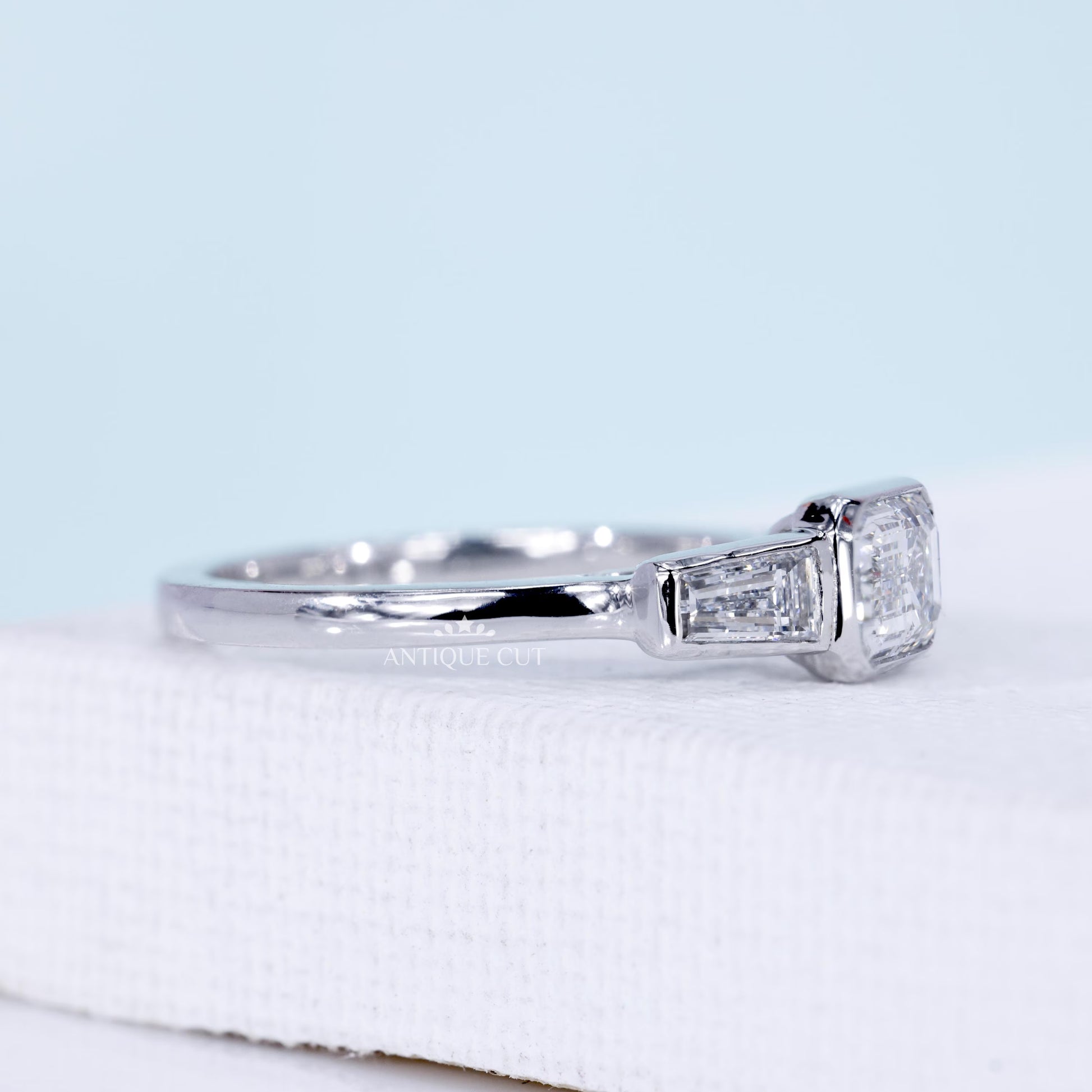 Emerald Cut Lab Grown Diamond Three Stone Engagement Ring with Tapered Baguette Side Stones in White Gold