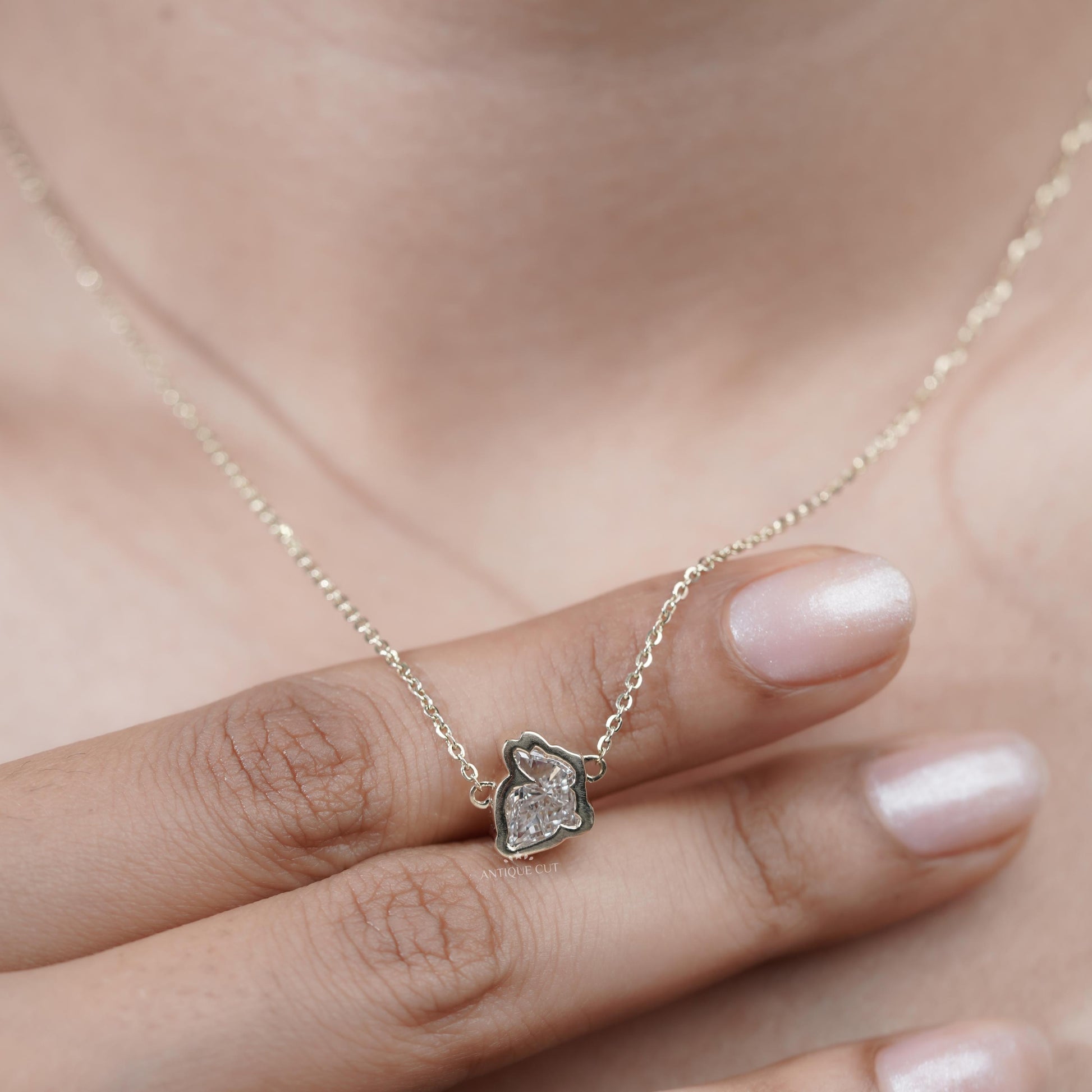 Elegant yellow gold diamond charm necklace