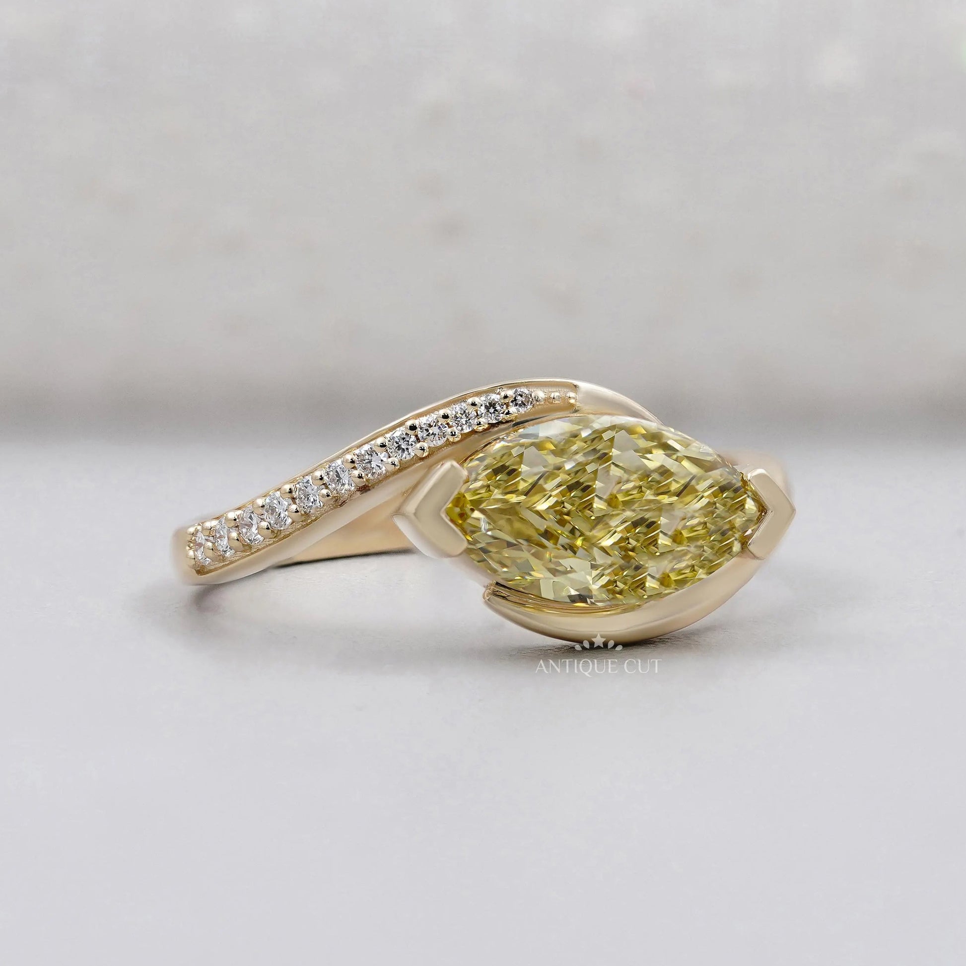Fancy yellow marquise cut diamond bypass engagement ring