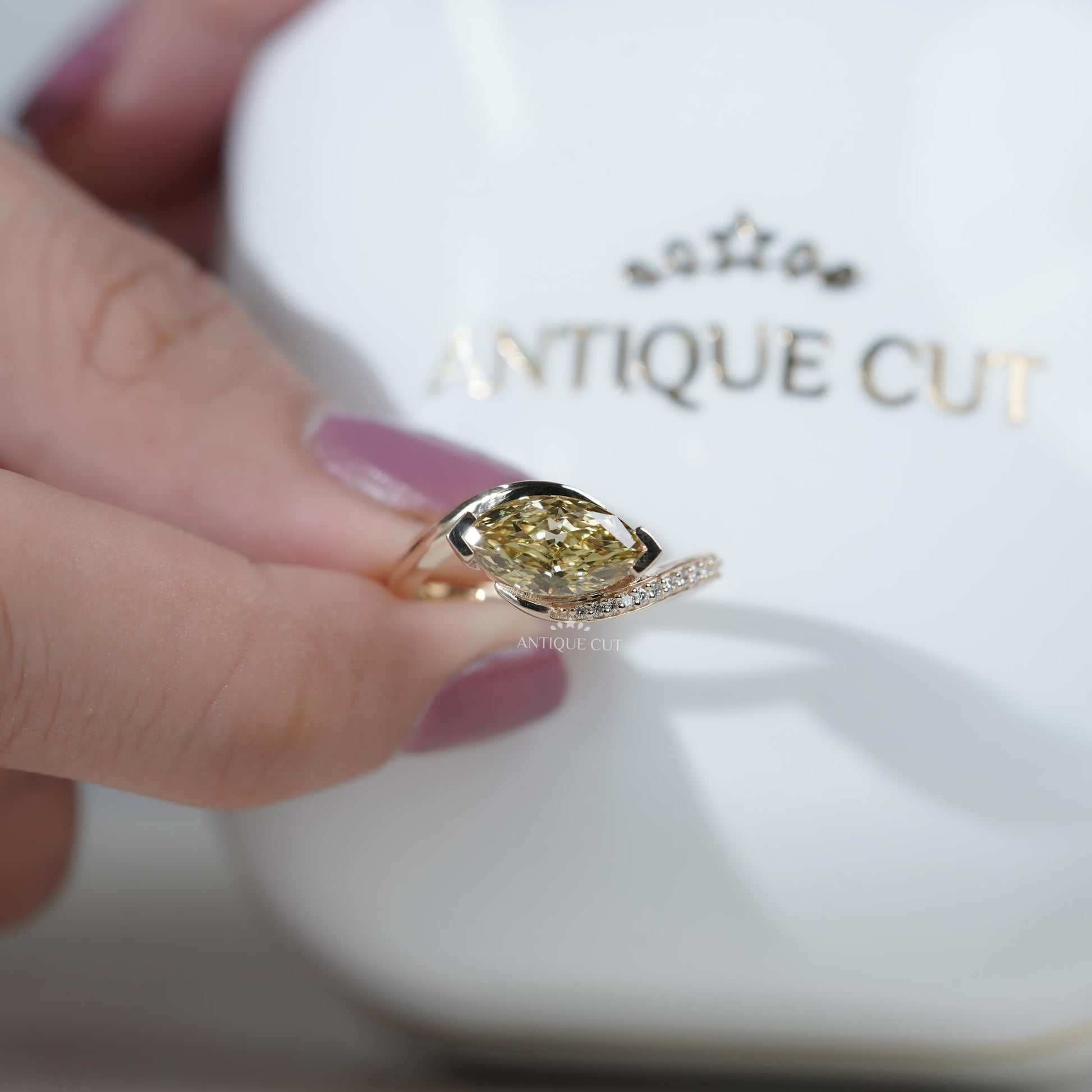 Modern bypass style yellow diamond engagement ring