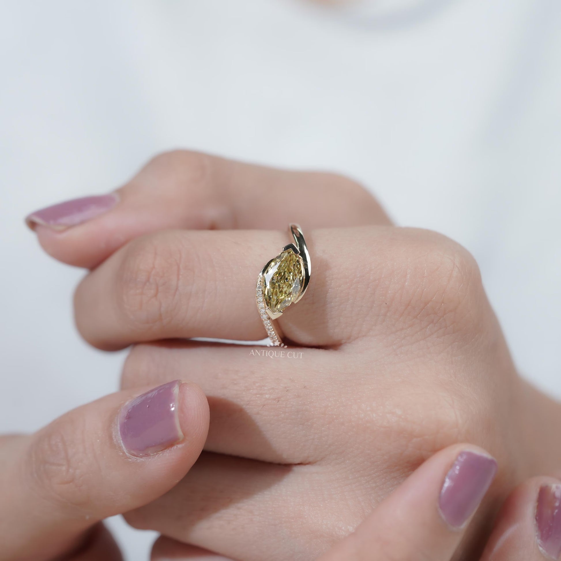 Elegant bypass engagement ring with marquise yellow diamond