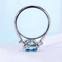 Women’s engagement ring featuring radiant cut diamond and side stones