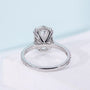 Women’s oval diamond ring featuring hidden halo setting