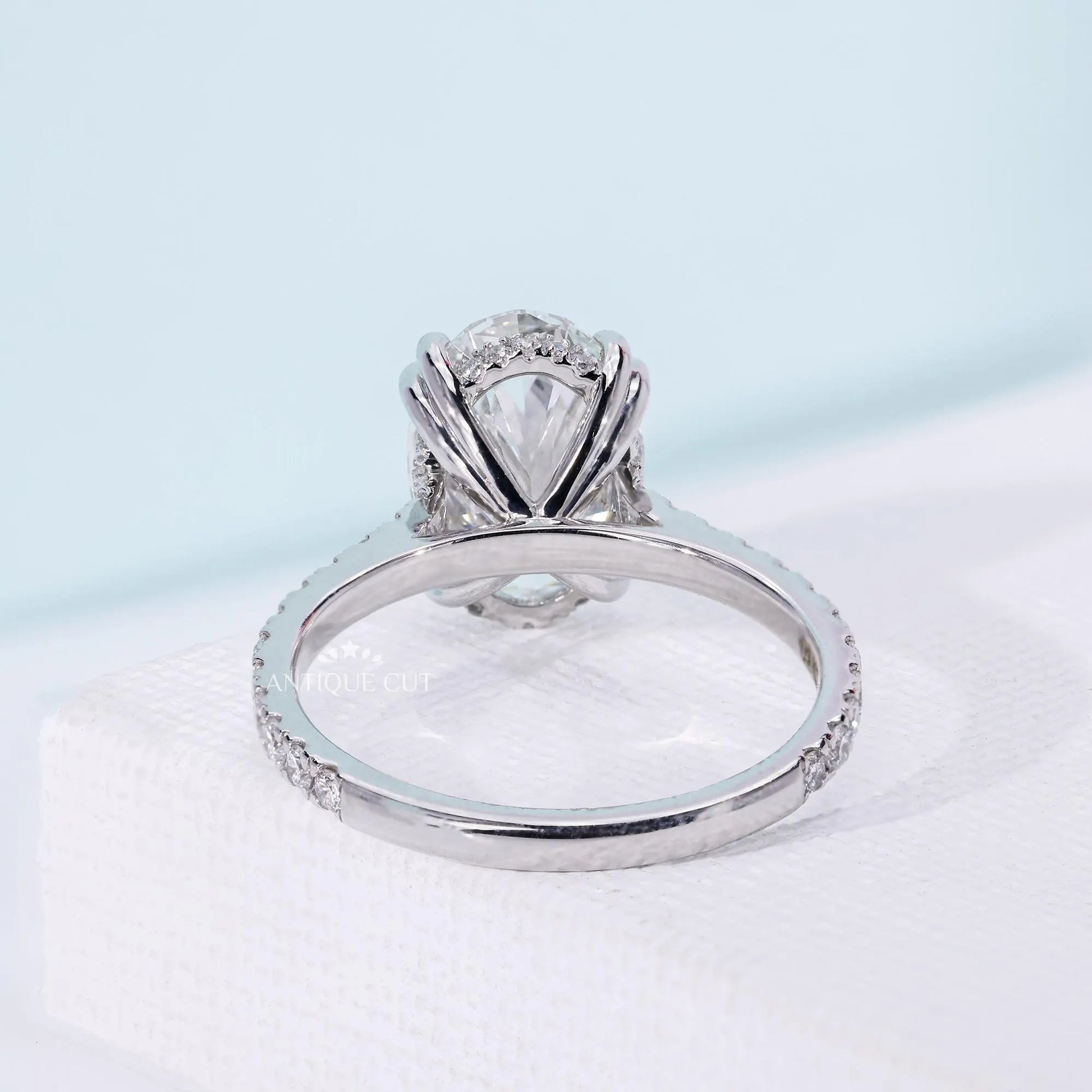 Women’s oval diamond ring featuring hidden halo setting