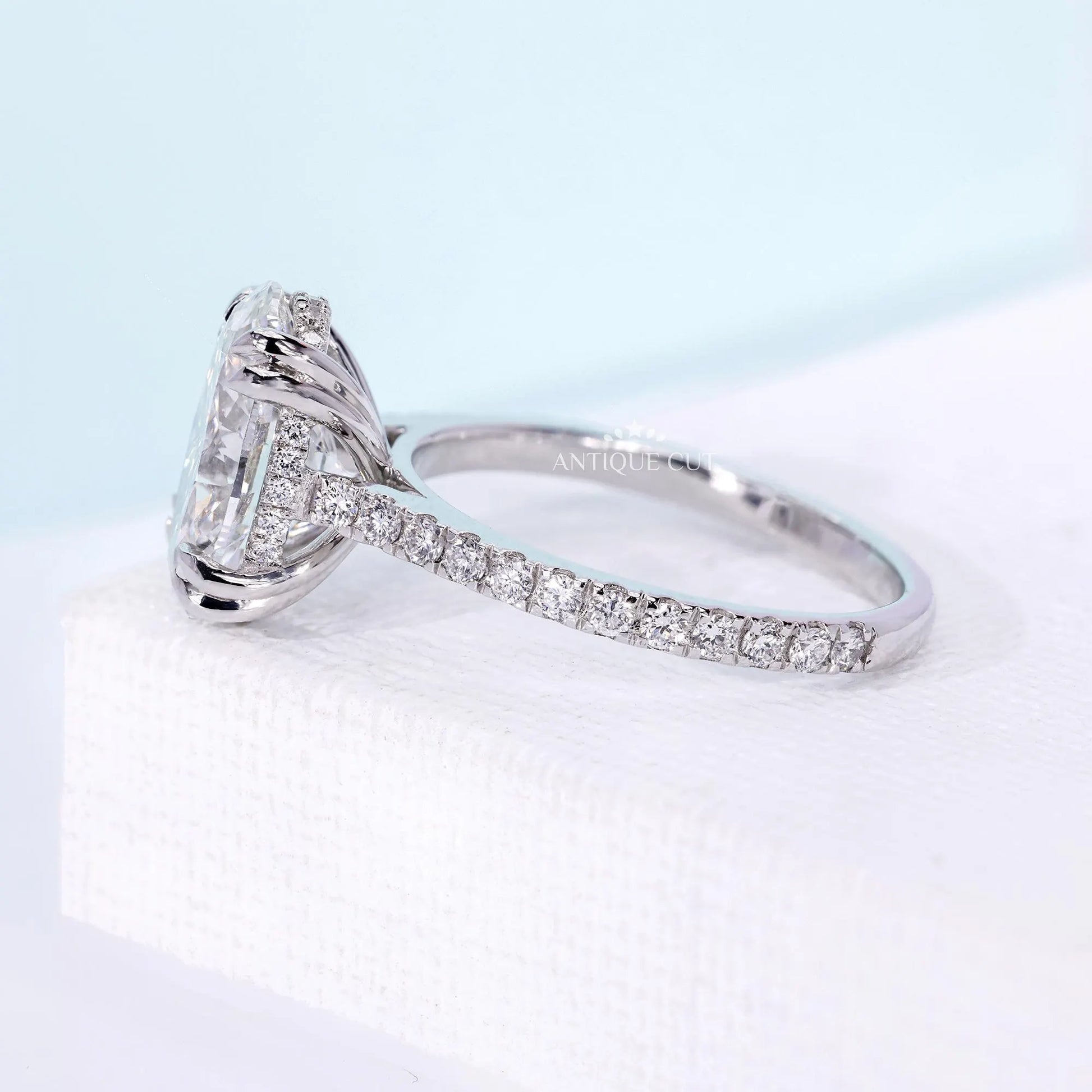 IGI certified oval diamond engagement ring with hidden halo detail