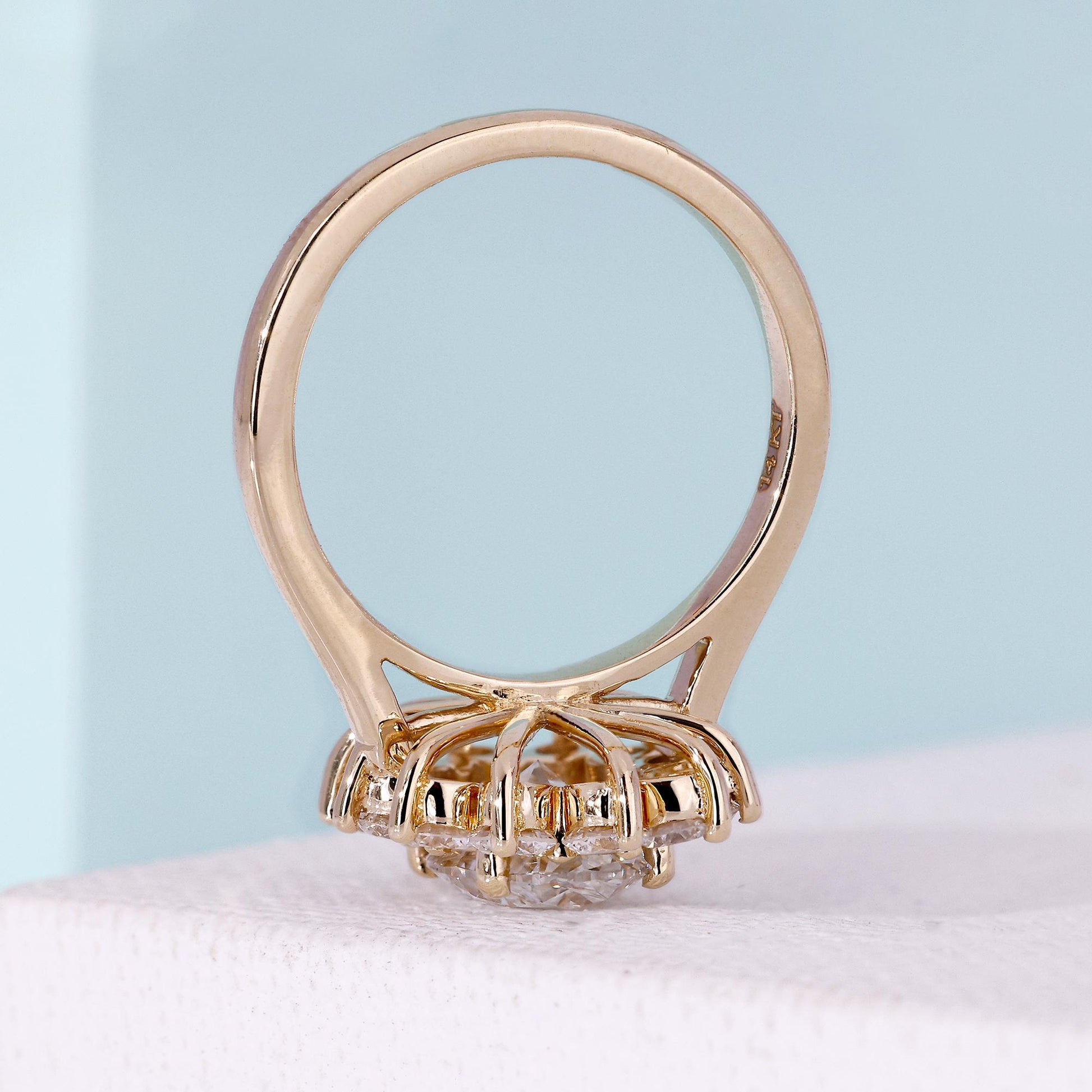 Oval halo diamond ring with secure round prong setting
