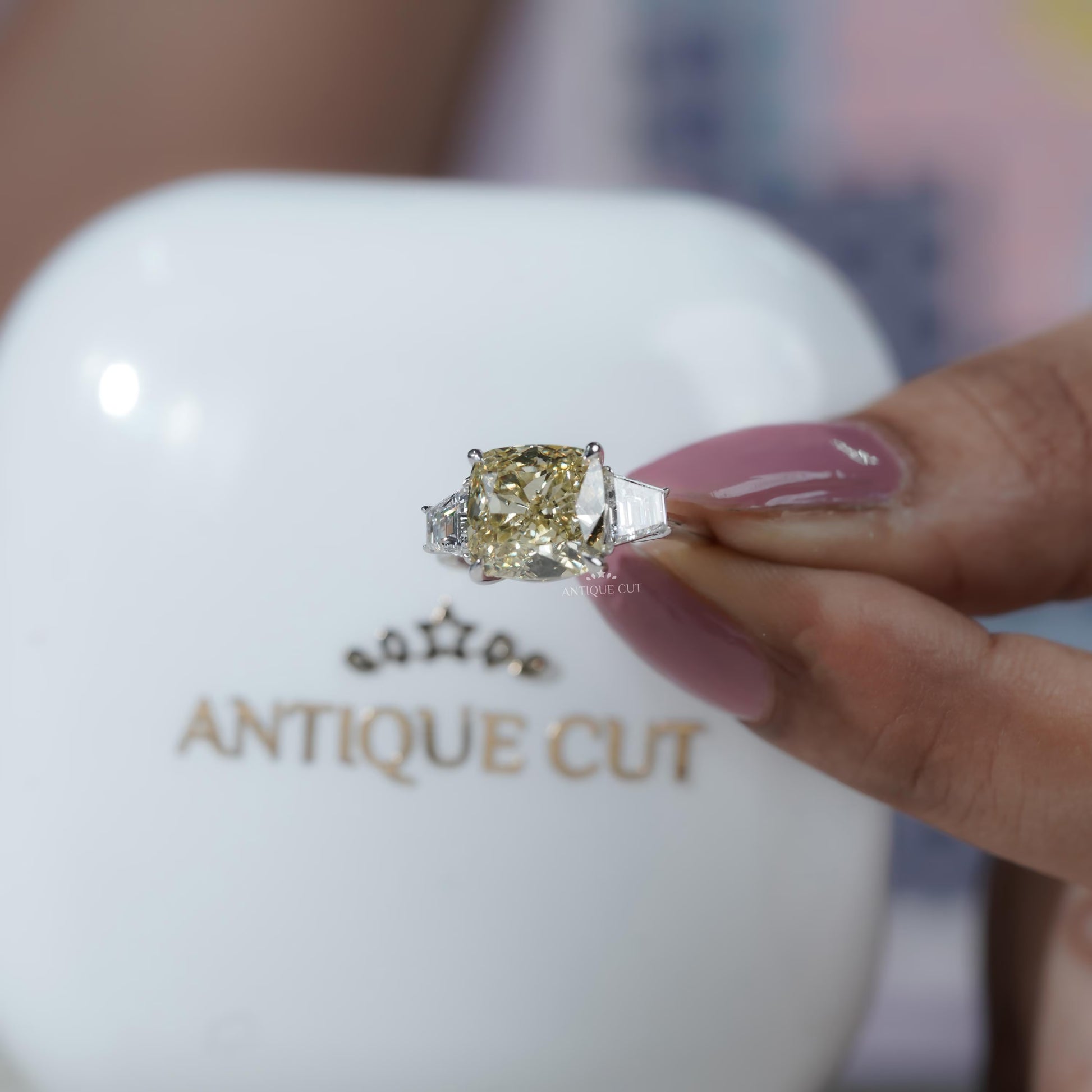 Proposal ring cushion cut yellow diamond with baguette sides