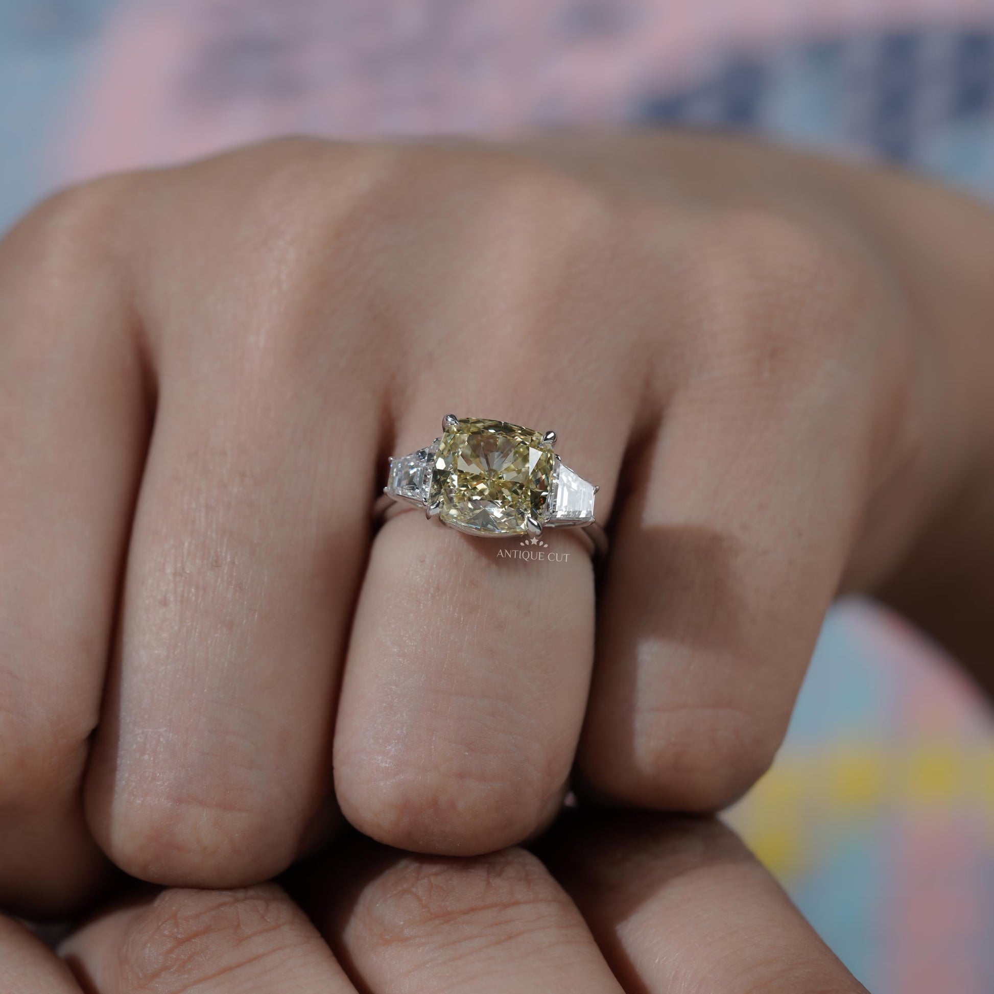 Statement bridal cushion cut three stone engagement ring
