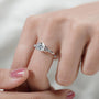 White gold diamond engagement ring with delicate leaf accents