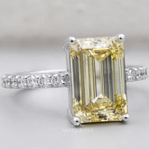 Fancy yellow emerald cut diamond engagement ring