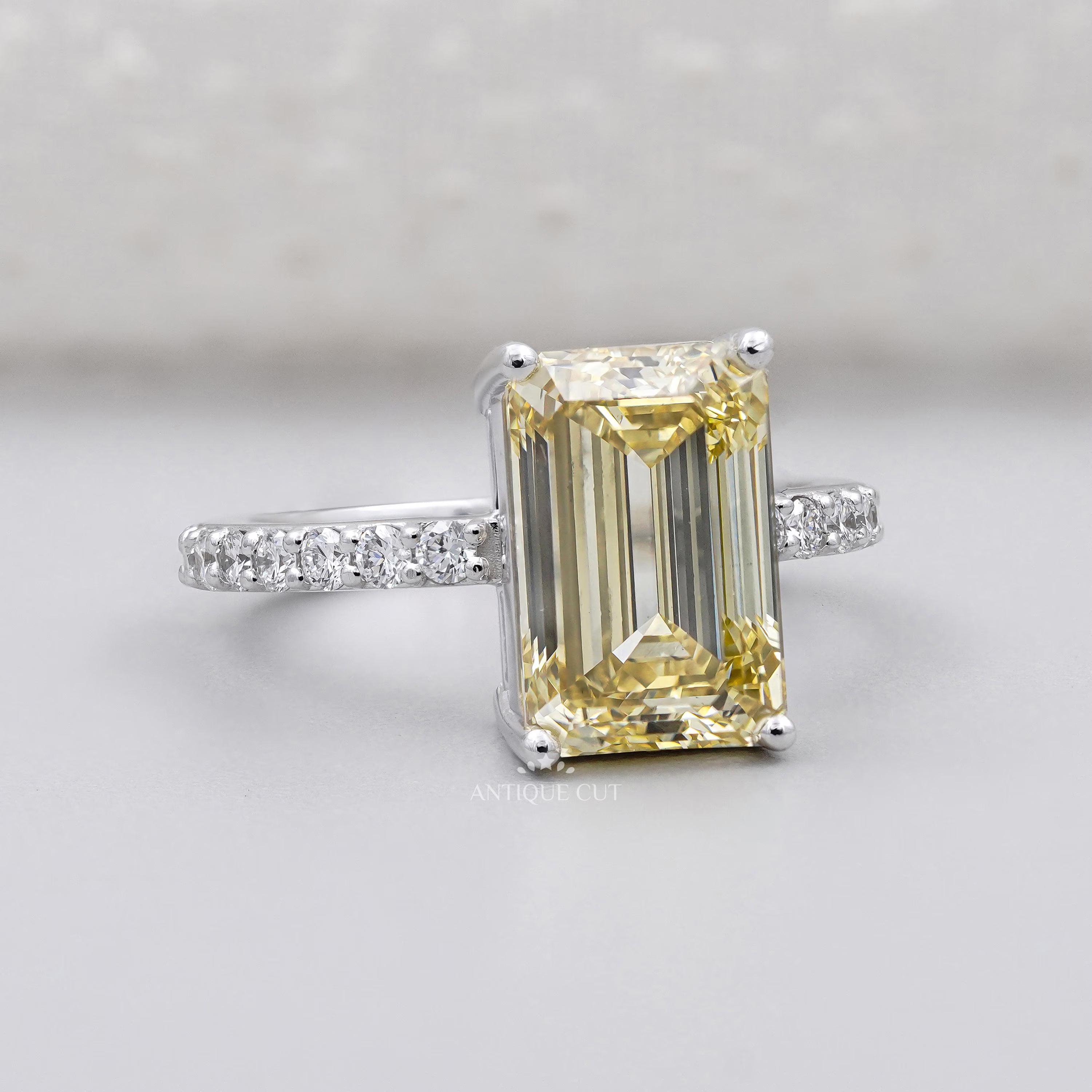 Fancy yellow emerald cut diamond solitaire engagement ring