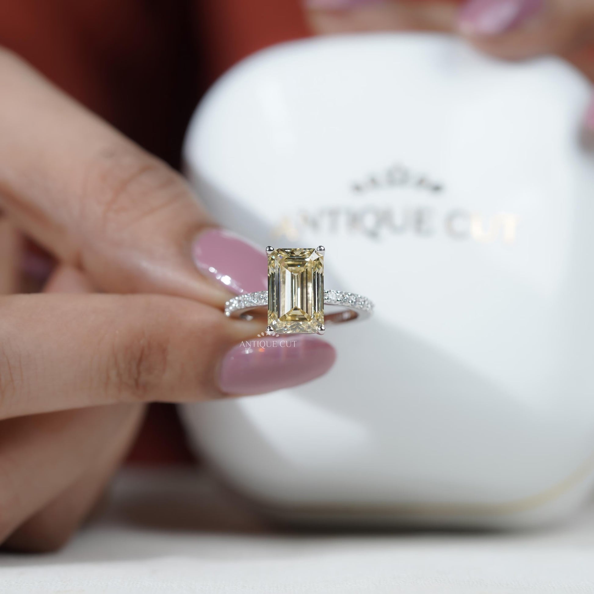 Luxury emerald cut yellow diamond solitaire ring