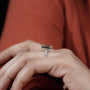 Elegant emerald cut diamond engagement ring with pave band