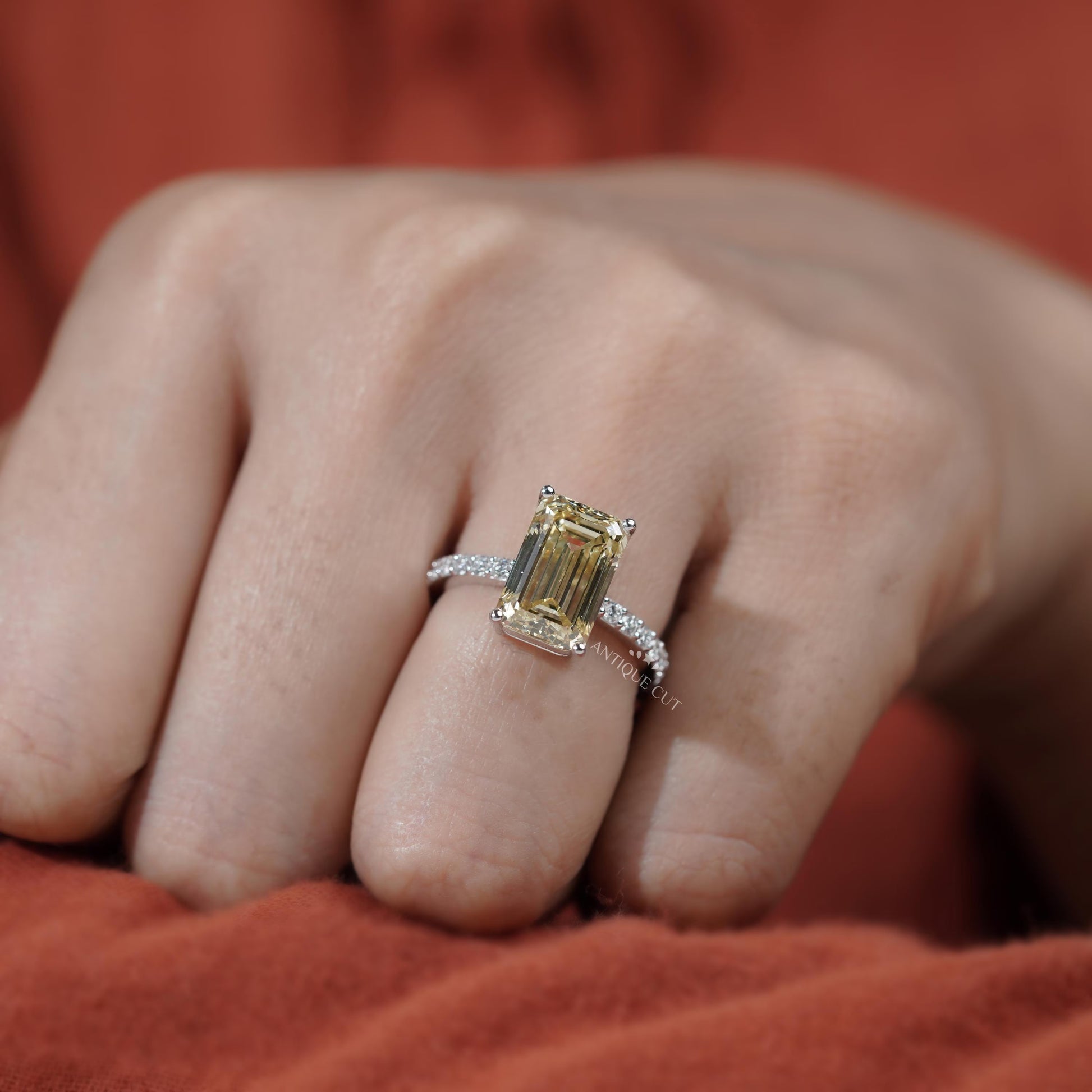 Proposal ring emerald cut yellow diamond with pave band