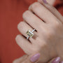 Contemporary white gold emerald cut engagement ring