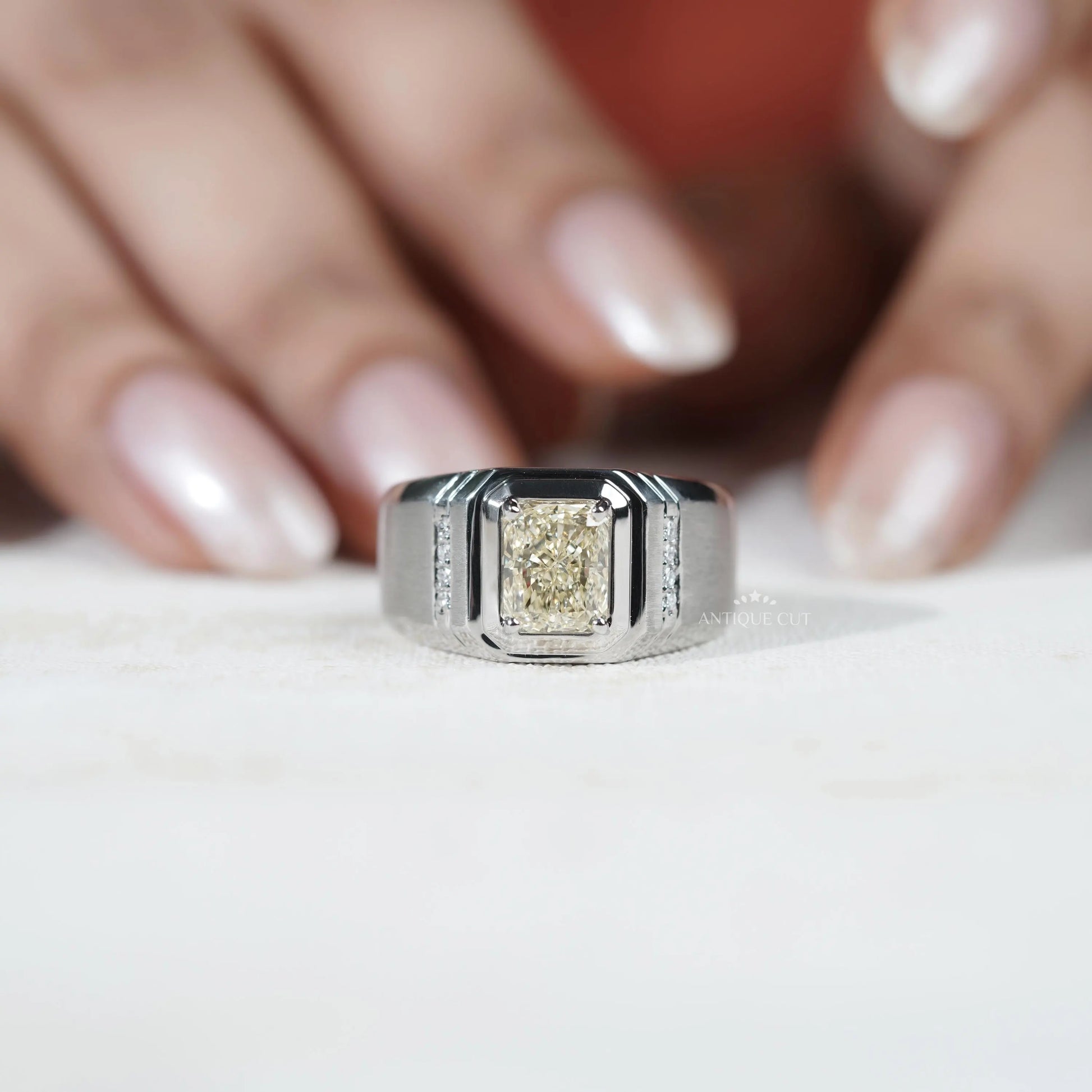 Men's engagement ring with round side stones