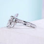 Oval diamond ring featuring unique bypass setting and 4 prong claws