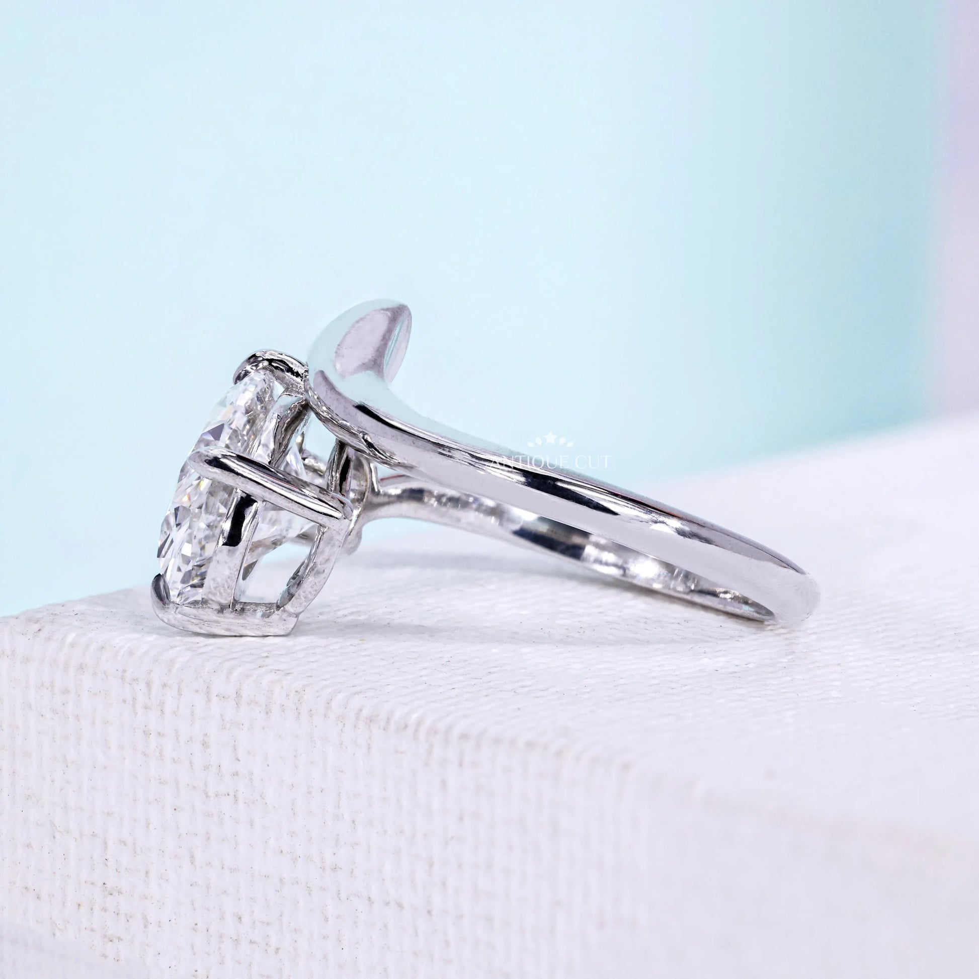 Oval diamond ring featuring unique bypass setting and 4 prong claws