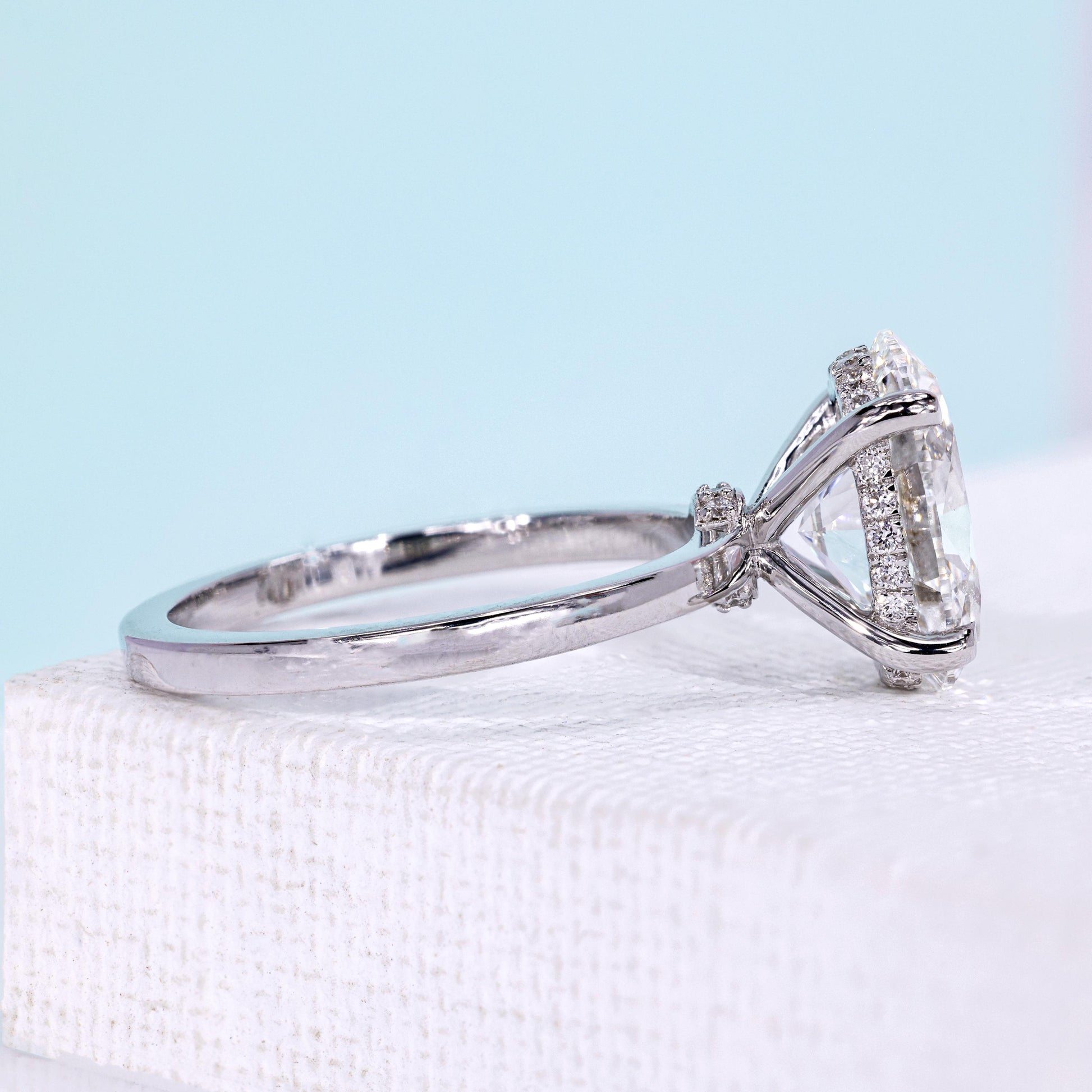 White gold oval diamond ring with solitaire claw prong design