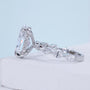 White gold oval diamond ring with marquise side stones and hidden halo setting