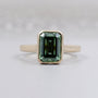 Emerald Cut Green Sapphire Bezel Set Engagement Ring in 14K Yellow Gold