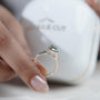 Emerald cut green sapphire proposal ring yellow gold