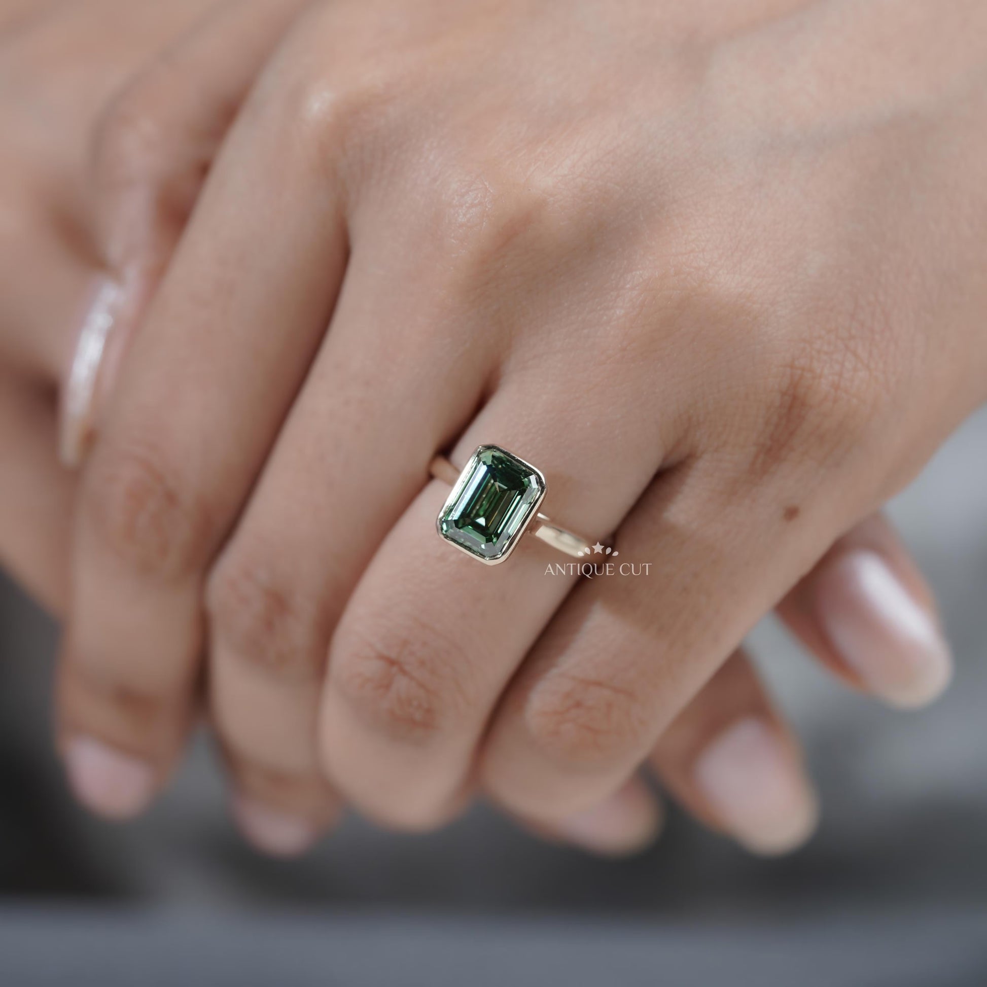 Unique emerald cut sapphire engagement ring