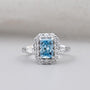 Radiant cut blue topaz halo engagement ring white gold