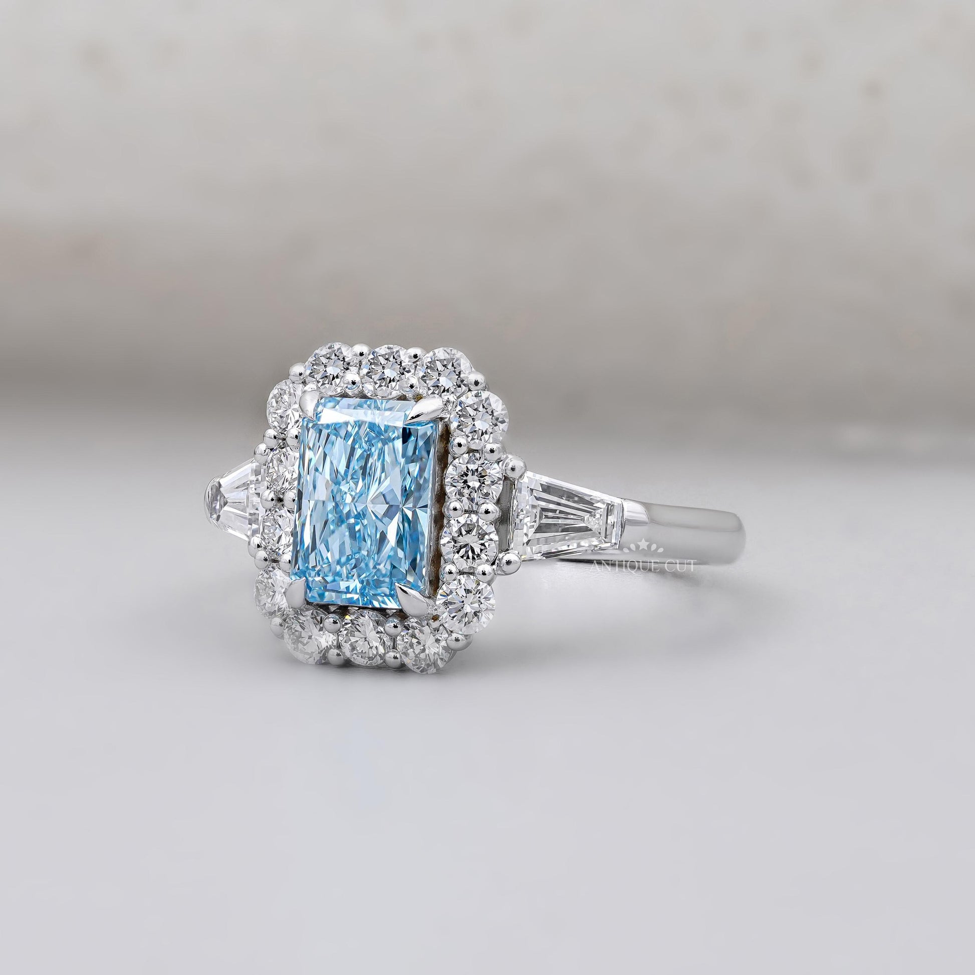 Antiquecut radiant cut blue topaz engagement ring
