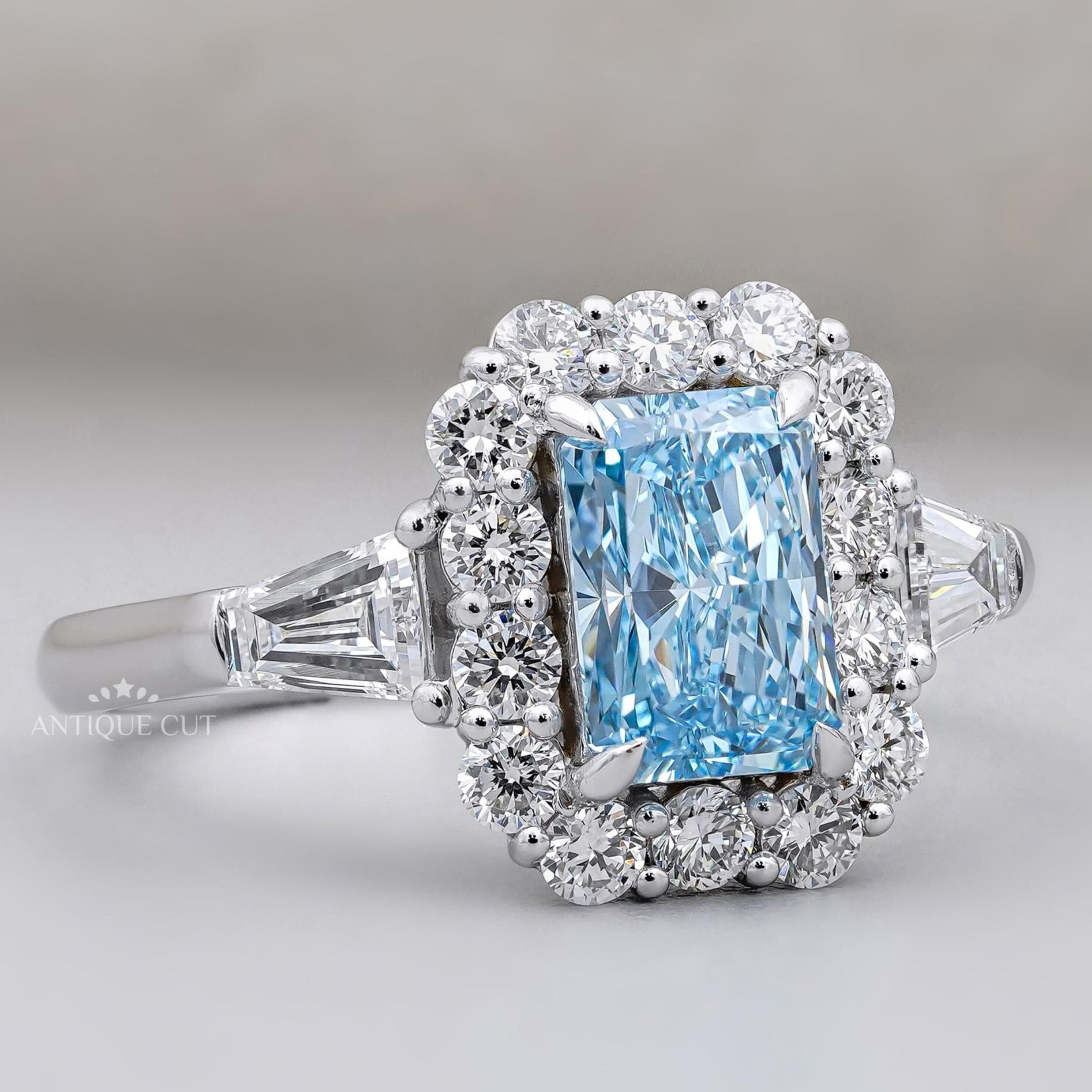 Lab grown blue topaz engagement ring with tapered baguette diamonds