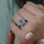 Modern white gold engagement ring with blue topaz