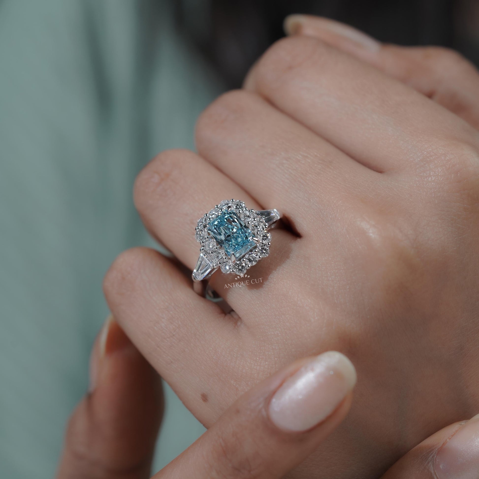 Modern white gold engagement ring with blue topaz