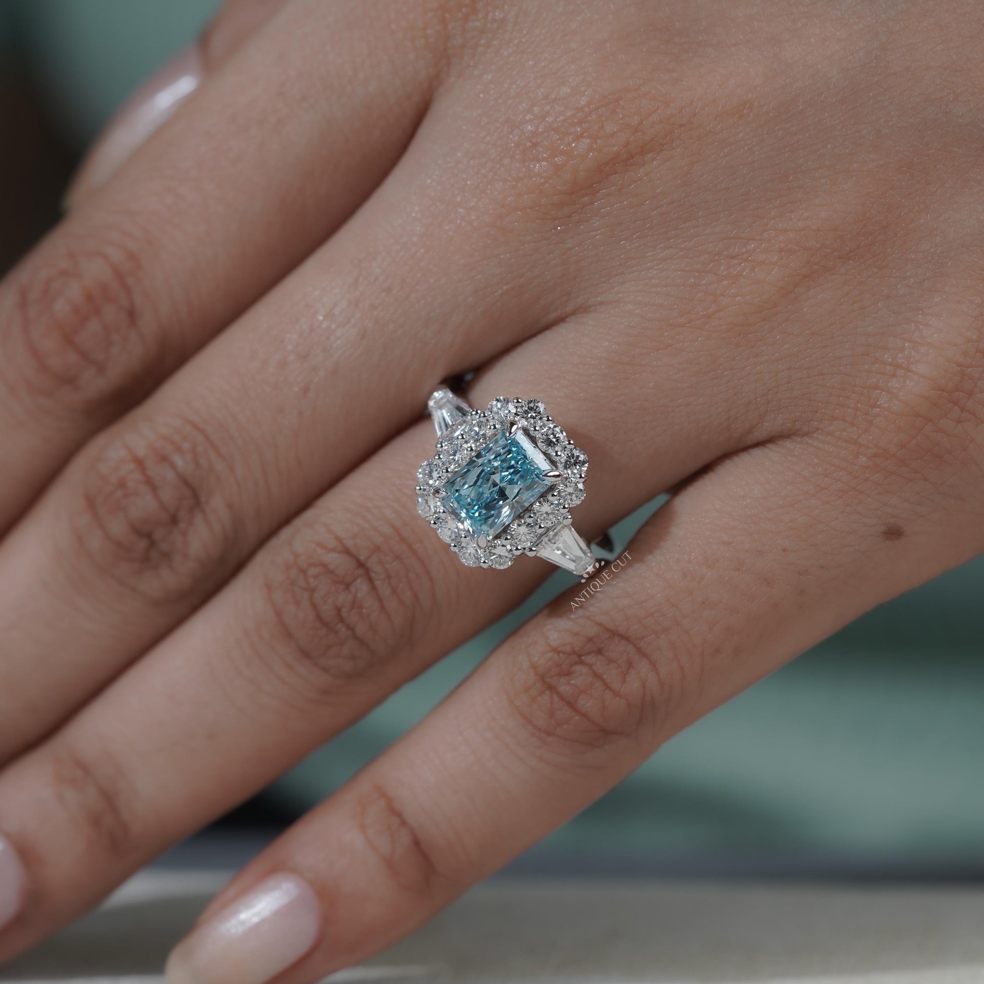Halo setting radiant cut blue topaz ring