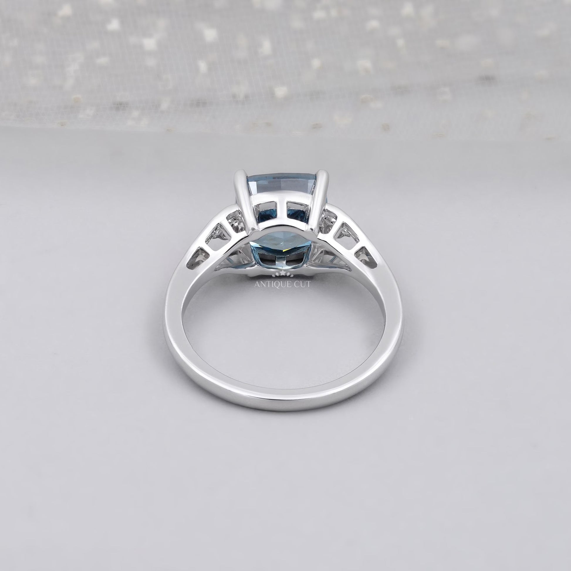 Lab grown cushion blue diamond ring with side stones