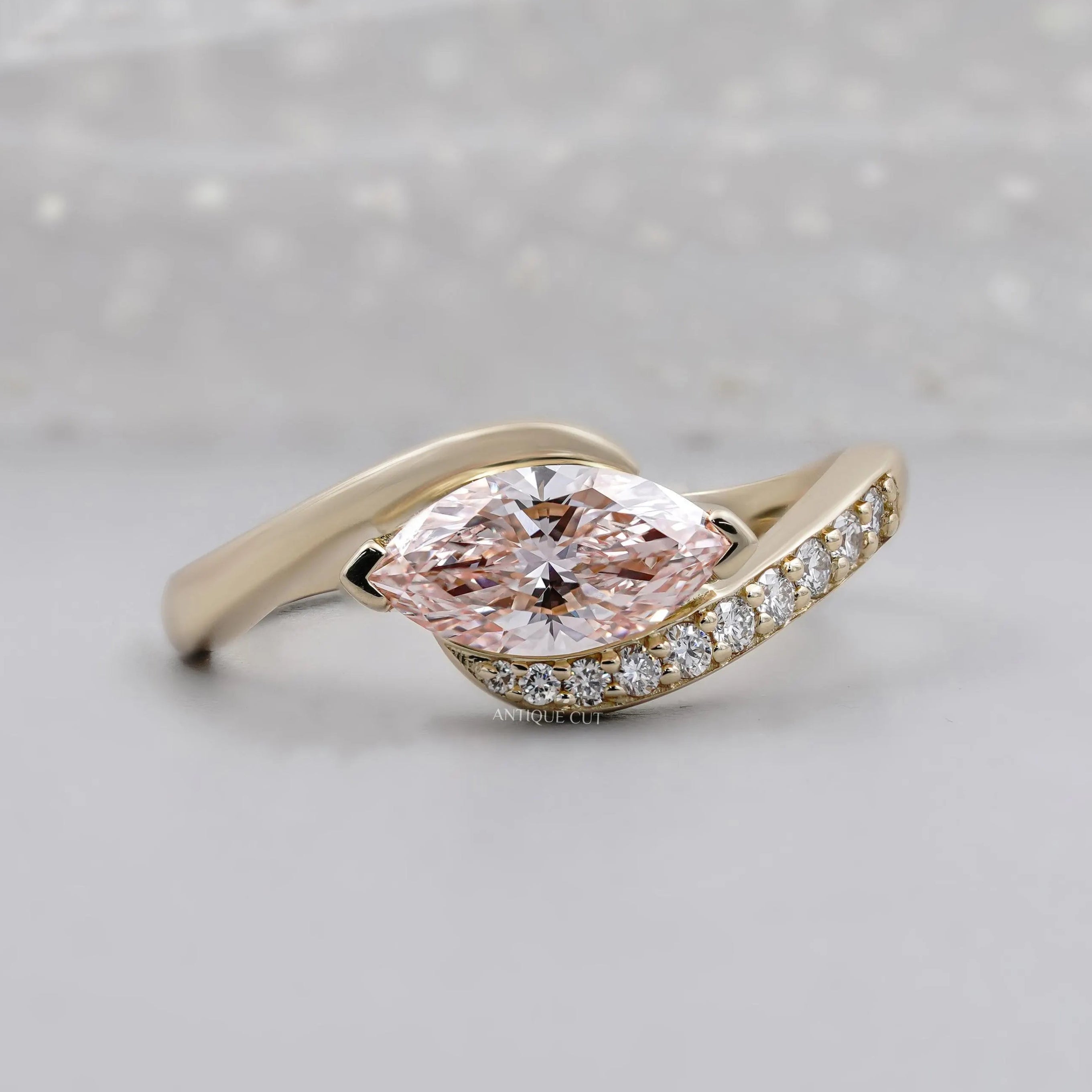 Fancy Pink Marquise Cut Diamond Engagement Ring Bypass Design with Round Side Stones IGI Certified