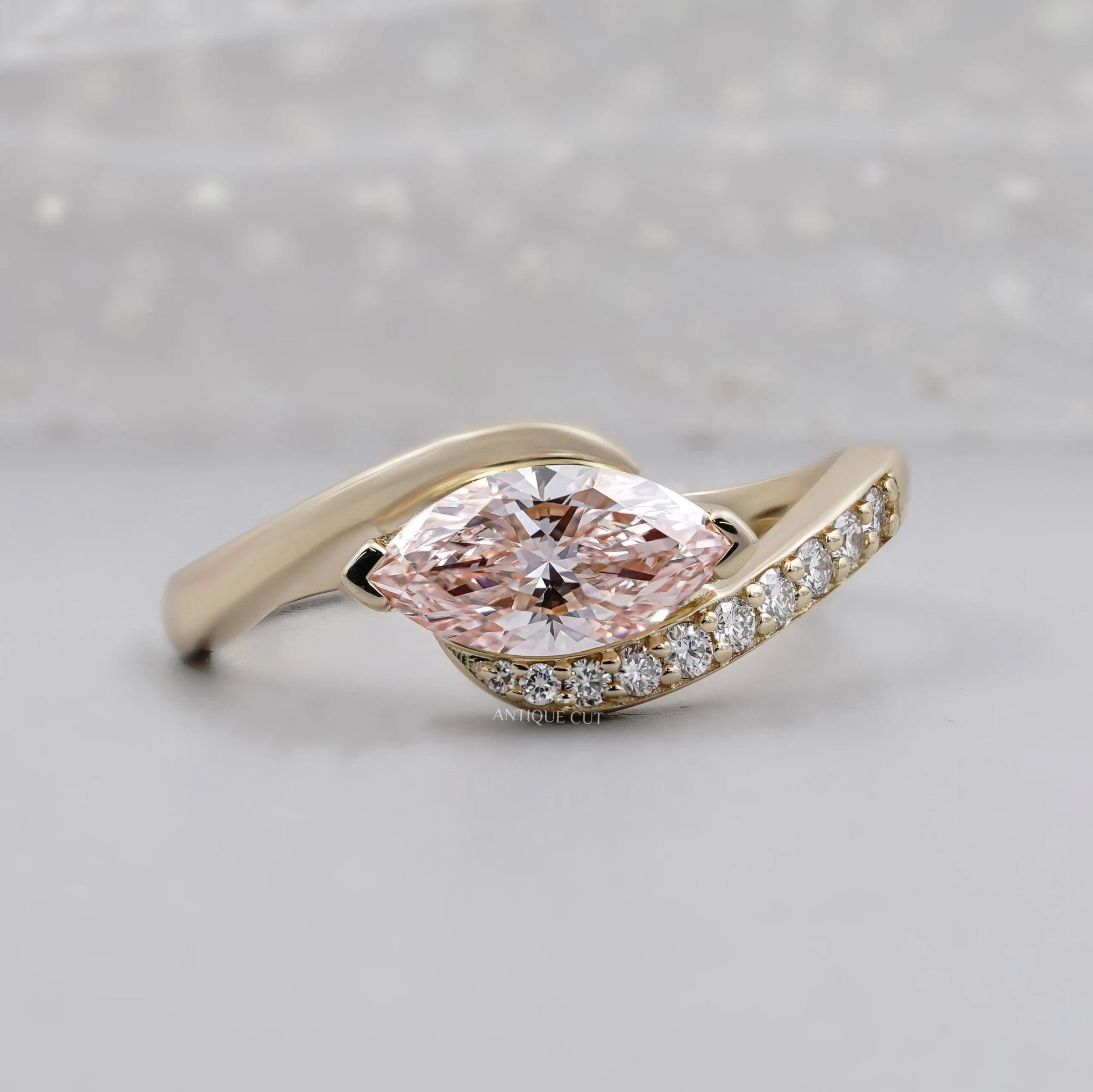 Fancy Pink Marquise Cut Diamond Engagement Ring Bypass Design with Round Side Stones IGI Certified