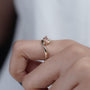Pink marquise diamond engagement ring with round side stones