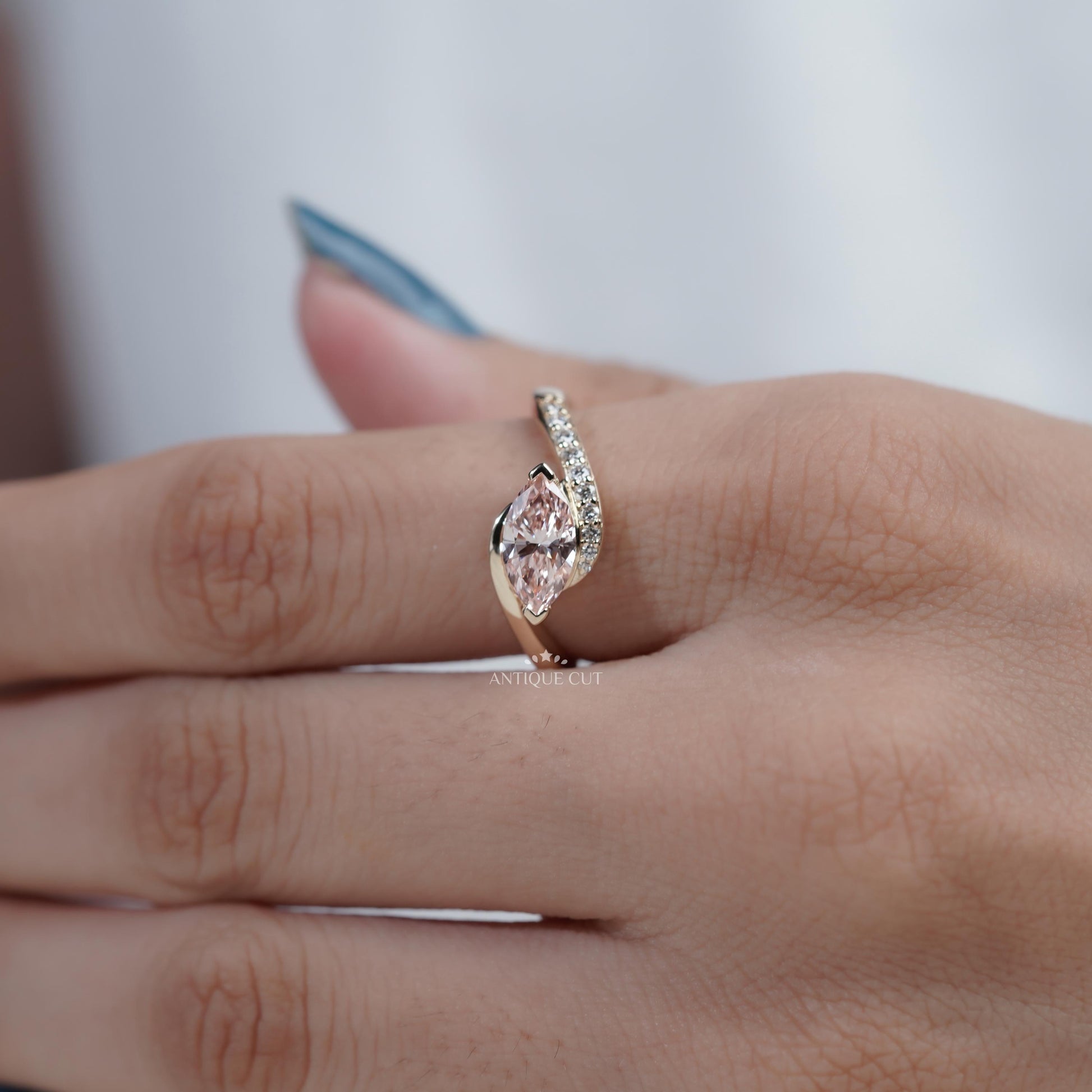 Elegant marquise pink diamond engagement ring in yellow gold